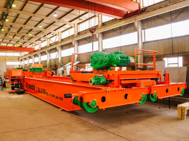 Double bogeys fitted to the end-carriages of this overhead crane represent the key to a puzzle recently solved by Condra: how to meet customer specifications while still being able to install the completed crane in a factory with no roof access and insufficient headroom