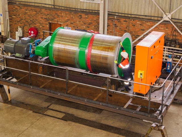The unusually large rope drum on this hoist, seen here nearing completion at Condra's Germiston factory, has been designed to hold and manage nearly 700 metres of rope, winding and unwinding it at high speed during very high lifts of 150 metres within a narrower-than-normal mineshaft.